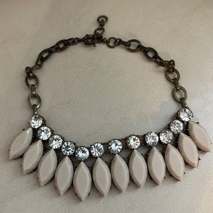 Flashy and classy costume jewelry necklace. Adjustable sizing.